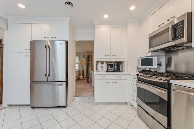 28 Verona Ct, New City, NY 10956 - kitchen featuring light countertops, stainless steel appliances, white cabinetry, light tile patterned floors, and visible vents