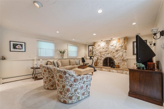 28 Verona Ct, New City, NY 10956 - carpeted living room with a baseboard radiator, wainscoting, recessed lighting, and a stone fireplace