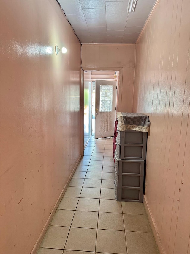 101-14 118th St, Richmond Hill S, NY 11419 - hall featuring light tile patterned flooring, wooden walls, and baseboards