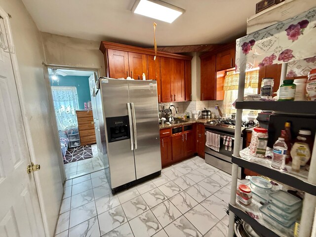 101-14 118th St, Richmond Hill S, NY 11419 - kitchen with stainless steel appliances, a sink, light marble finish flooring, and decorative backsplash