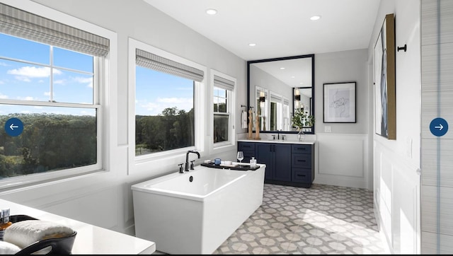 22 Sienna Ct, Dix Hills, NY 11746 - full bath with recessed lighting, vanity, tile patterned floors, a freestanding bath, and wainscoting