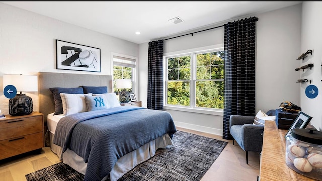 22 Sienna Ct, Dix Hills, NY 11746 - bedroom with visible vents, light wood-style floors, and recessed lighting