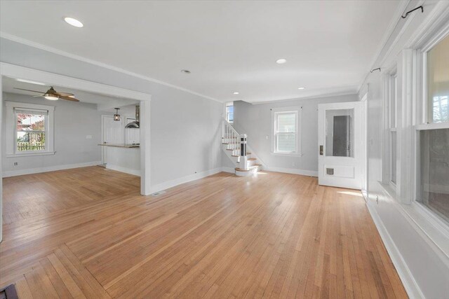 118 N Regent St, Port Chester, NY 10573 - unfurnished living room with ornamental molding, stairs, and plenty of natural light