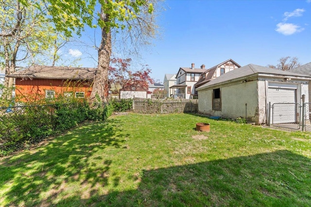 118 N Regent St, Port Chester, NY 10573 - view of yard featuring a gate, an attached garage, and a fenced backyard