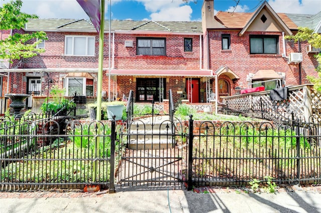 48-42 64th St, Woodside, NY 11377 - view of front facade with a porch, a fenced front yard, brick siding, a gate, and a chimney
