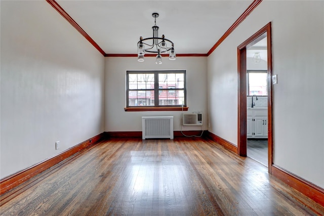 48-42 64th St, Woodside, NY 11377 - unfurnished room with radiator heating unit, wood finished floors, a chandelier, and baseboards