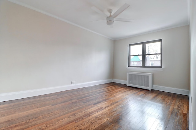 48-42 64th St, Woodside, NY 11377 - unfurnished room with dark wood-style flooring, baseboards, crown molding, and radiator