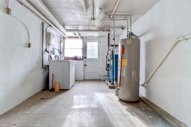 48-42 64th St, Woodside, NY 11377 - basement featuring gas water heater and washer / dryer