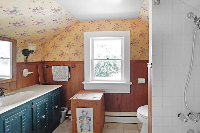 48 Watchogue Ave, East Moriches, NY 11940 - bathroom with vaulted ceiling, wallpapered walls, a wainscoted wall, and a baseboard heating unit