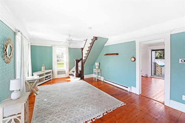 48 Watchogue Ave, East Moriches, NY 11940 - living area with ceiling fan, stairway, hardwood / wood-style flooring, and baseboards
