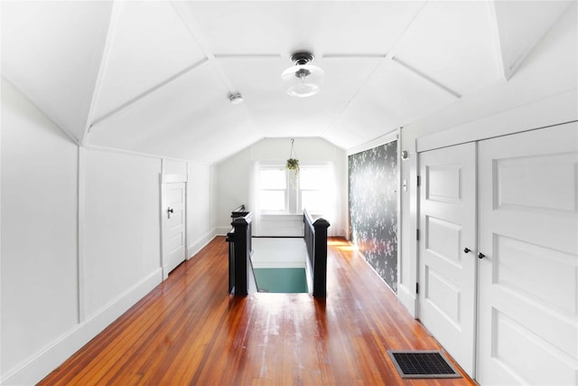 48 Watchogue Ave, East Moriches, NY 11940 - bonus room with baseboards, visible vents, wood-type flooring, and vaulted ceiling