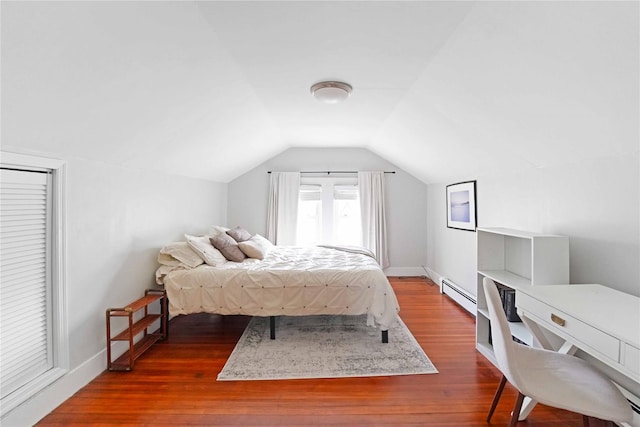 48 Watchogue Ave, East Moriches, NY 11940 - bedroom with vaulted ceiling, dark wood-style floors, a baseboard heating unit, and baseboards