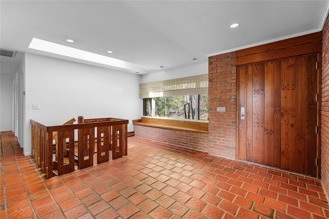 dining room featuring brick floors and recessed lighting