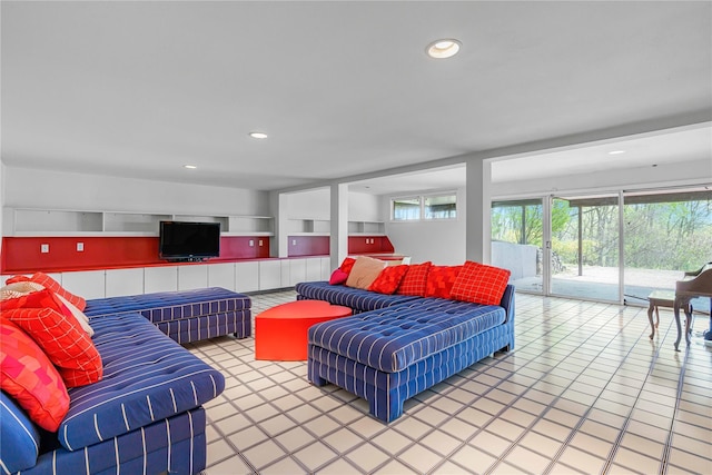 living room with tile patterned flooring and recessed lighting