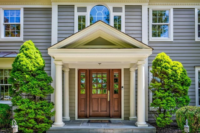 doorway to property featuring a porch