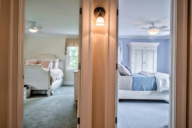 carpeted bedroom with baseboards, ornamental molding, and ceiling fan
