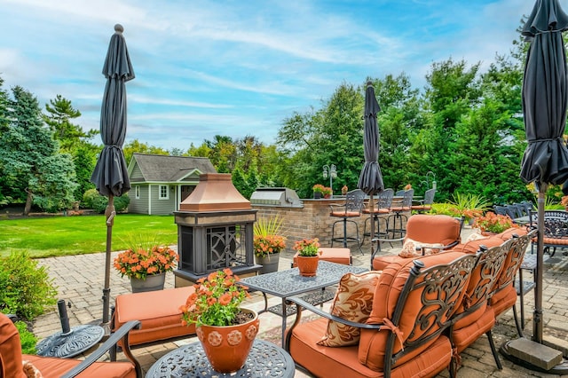 view of patio featuring an outdoor structure, an outdoor hangout area, exterior kitchen, outdoor dining space, and outdoor dry bar