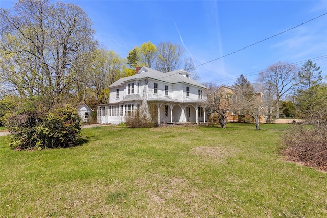 26705 Main Rd, Cutchogue, NY 11935 - rear view of house featuring covered porch and a lawn