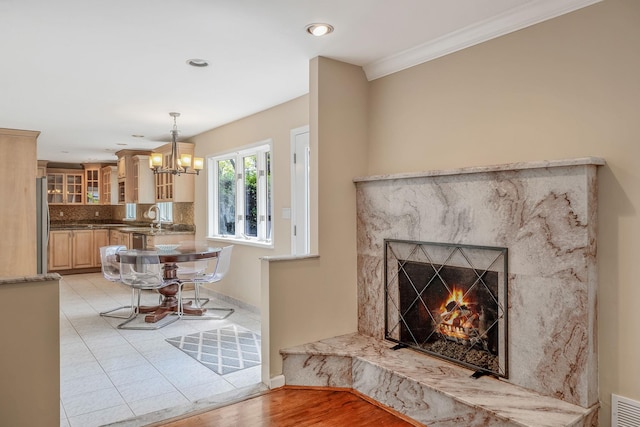 57 Seward Dr, Dix Hills, NY 11746 - living room with baseboards, recessed lighting, a high end fireplace, light tile patterned floors, and a notable chandelier