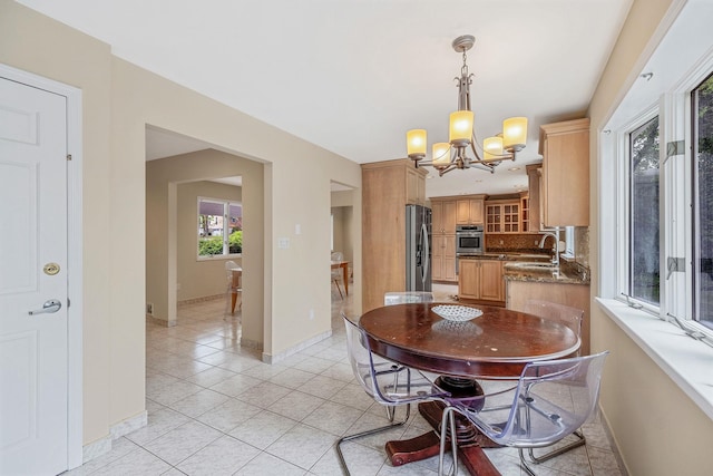 57 Seward Dr, Dix Hills, NY 11746 - dining area with light tile patterned floors, baseboards, and a notable chandelier