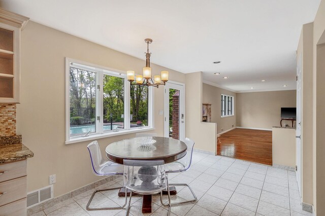 57 Seward Dr, Dix Hills, NY 11746 - dining area with visible vents, an inviting chandelier, baseboards, recessed lighting, and light tile patterned floors