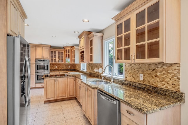 57 Seward Dr, Dix Hills, NY 11746 - kitchen with appliances with stainless steel finishes, a sink, light brown cabinets, decorative backsplash, and light tile patterned floors
