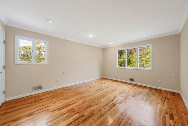 57 Seward Dr, Dix Hills, NY 11746 - empty room featuring visible vents, ornamental molding, baseboards, and light wood-type flooring