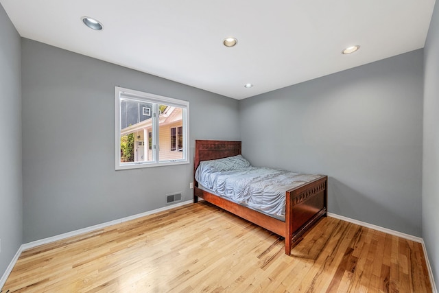 57 Seward Dr, Dix Hills, NY 11746 - bedroom featuring baseboards, recessed lighting, wood finished floors, and visible vents