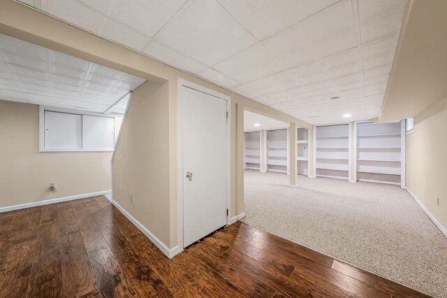 57 Seward Dr, Dix Hills, NY 11746 - finished below grade area with wood-type flooring, baseboards, and a drop ceiling