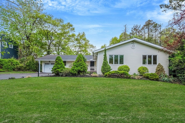 57 Seward Dr, Dix Hills, NY 11746 - single story home with an attached garage, a front lawn, and aphalt driveway