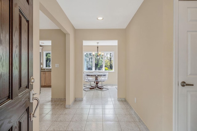 57 Seward Dr, Dix Hills, NY 11746 - corridor featuring an inviting chandelier, recessed lighting, baseboards, and light tile patterned floors