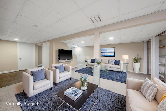 57 Seward Dr, Dix Hills, NY 11746 - carpeted living area with baseboards, a drop ceiling, and visible vents