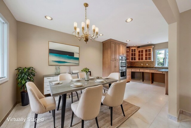 57 Seward Dr, Dix Hills, NY 11746 - dining room with baseboards, a chandelier, recessed lighting, and arched walkways