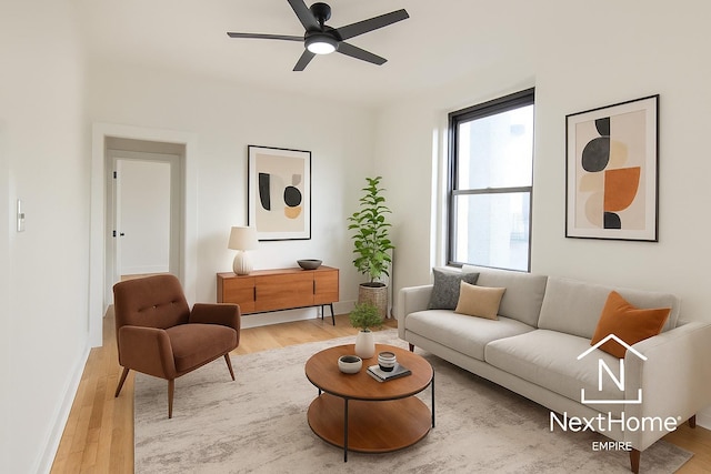 21-58 35th St Unit 5G, Astoria, NY 11105 - living room featuring light wood-type flooring, ceiling fan, and baseboards