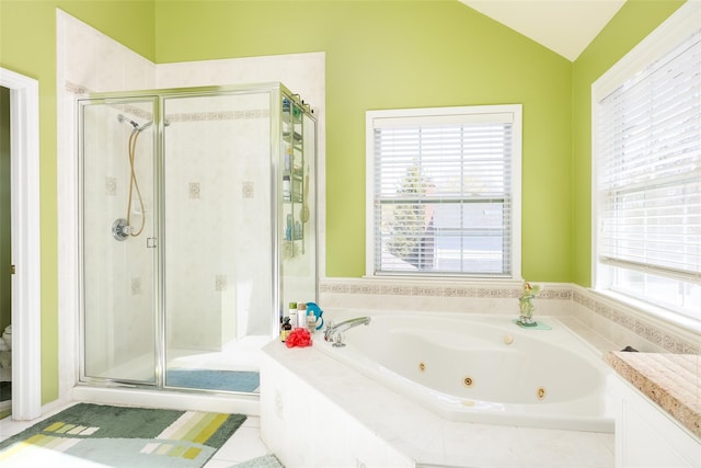 full bath with vanity, a whirlpool tub, toilet, a stall shower, and lofted ceiling