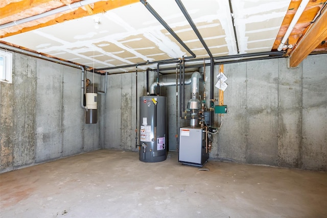 basement featuring a heating unit and water heater