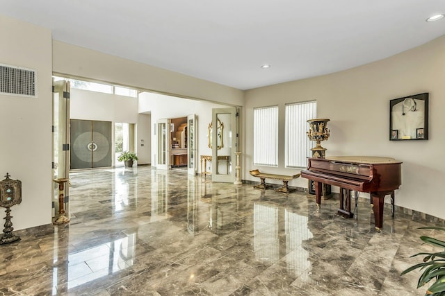 9 Dock Ln, Kings Point, NY 11024 - living area featuring marble tiled floors and recessed lighting