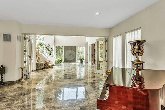 9 Dock Ln, Kings Point, NY 11024 - entryway featuring marble tiled floors and recessed lighting