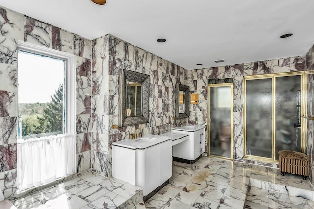 9 Dock Ln, Kings Point, NY 11024 - full bathroom featuring wallpapered walls, two vanities, a stall shower, and marble finish floors