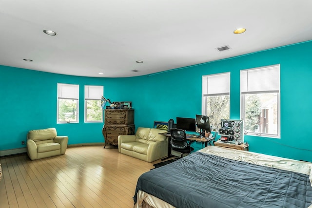 9 Dock Ln, Kings Point, NY 11024 - bedroom featuring a baseboard radiator, recessed lighting, hardwood / wood-style flooring, and baseboards