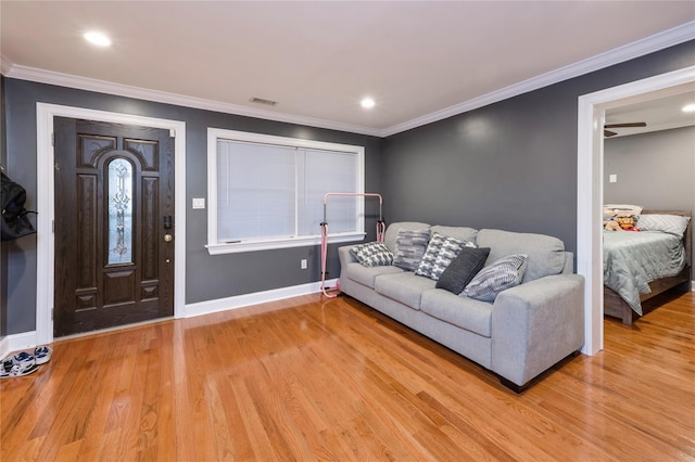 258 Longstreet Ave, Bronx, NY 10465 - living room featuring baseboards, visible vents, crown molding, and light wood finished floors