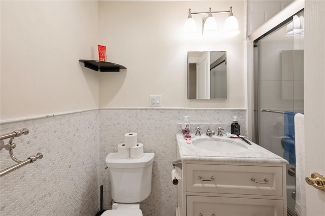 258 Longstreet Ave, Bronx, NY 10465 - bathroom featuring toilet, a wainscoted wall, tile walls, and vanity