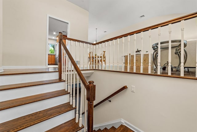 staircase featuring baseboards