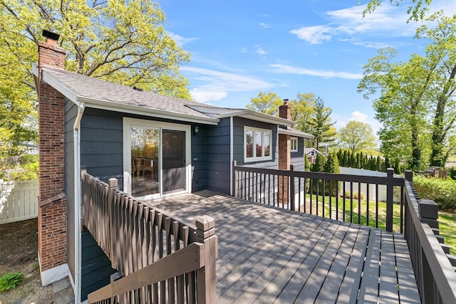 wooden deck featuring fence