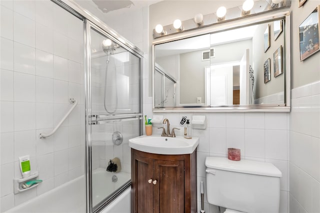 1203 E Broadway Unit G11, Hewlett, NY 11557 - full bath with vanity, combined bath / shower with glass door, toilet, and visible vents