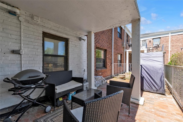 1203 E Broadway Unit G11, Hewlett, NY 11557 - view of patio with an outdoor hangout area, a grill, and a balcony