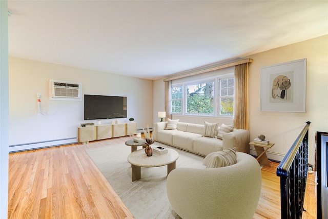living area featuring a baseboard radiator, wood finished floors, and a wall mounted air conditioner
