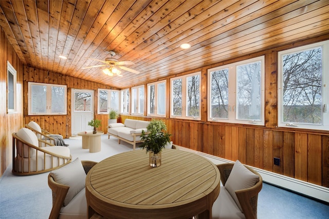 sunroom / solarium featuring a baseboard heating unit