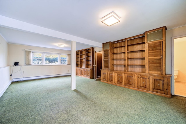 interior space featuring carpet flooring, beamed ceiling, and a baseboard heating unit