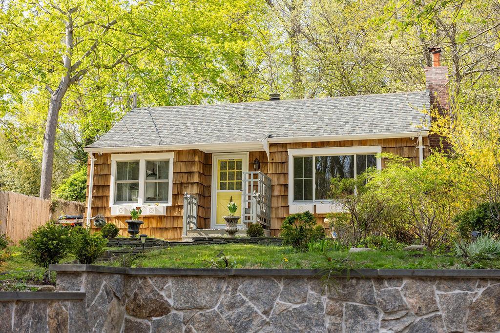 65 Hollow Rd, Stony Brook, NY 11790 - ranch-style home featuring a chimney, a shingled roof, and fence